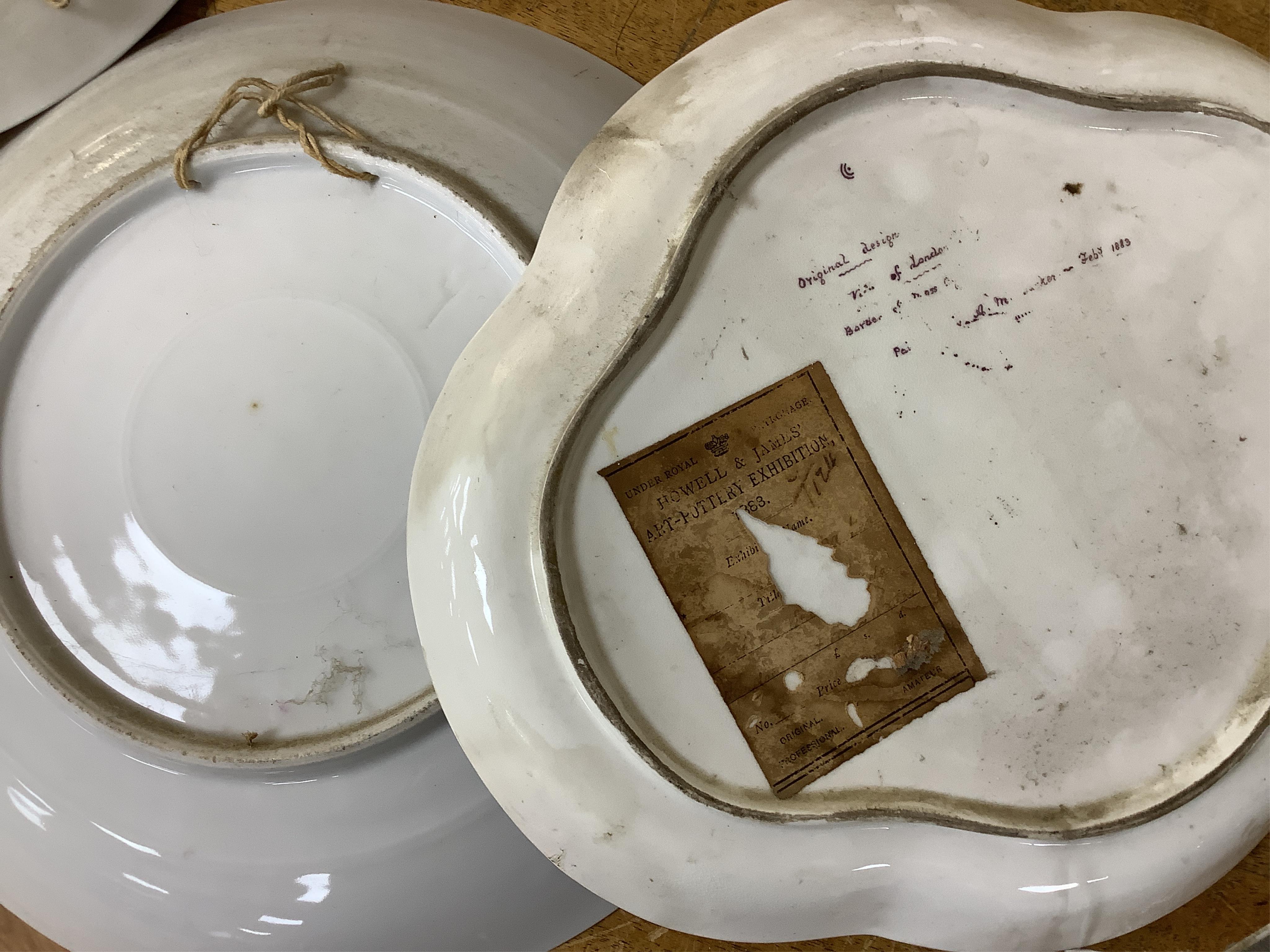 A German porcelain figural centrepiece, lobed dish, three other plates and two others